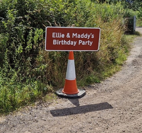 A brown UK landmark sign for a birthday party