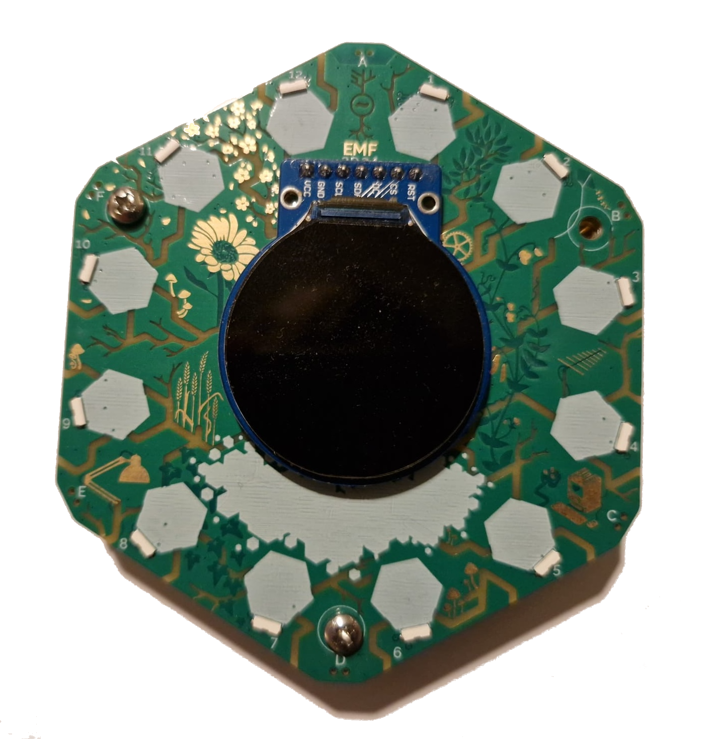 My badge from EMF 2024 which is a microcomputer with display and ports for hexpansions